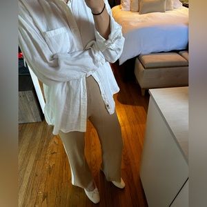 Dissh ribbed cream colored pants with white pinstripe on sides.